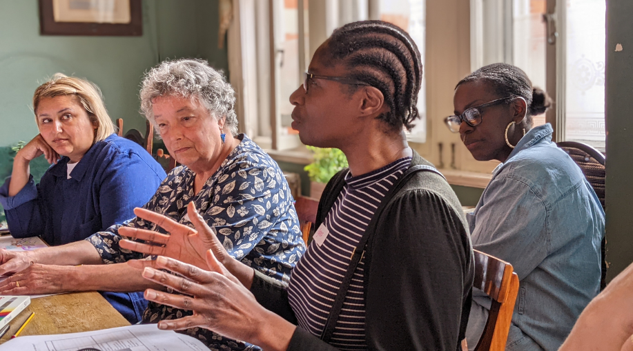 Community Engagement - people talking around a table